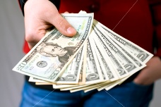 hand-giving-dollar-money.jpg